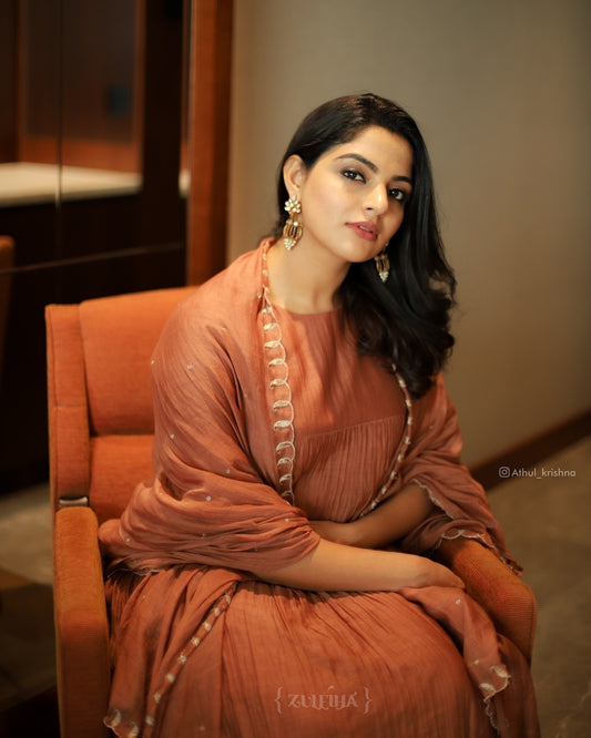 Nikhila Vimal in Rust Orange Kurti Set Zuleiha